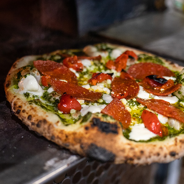 Neapolitan style pizza featuring Grande fresh mozzarella cheese coming out of the the oven